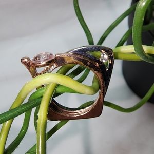 Modern style costume ring set in rose gold and silver tones with inset crystals